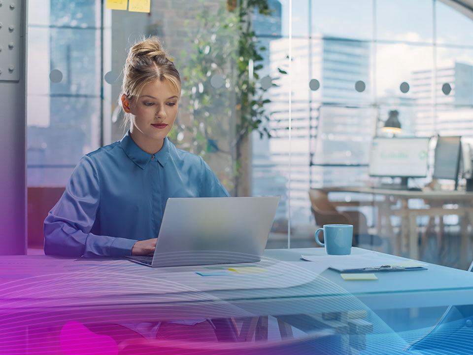 Portrait of a Smiling White Female Working on a Creative Job Position in an Advertising Company Using Laptop Computer